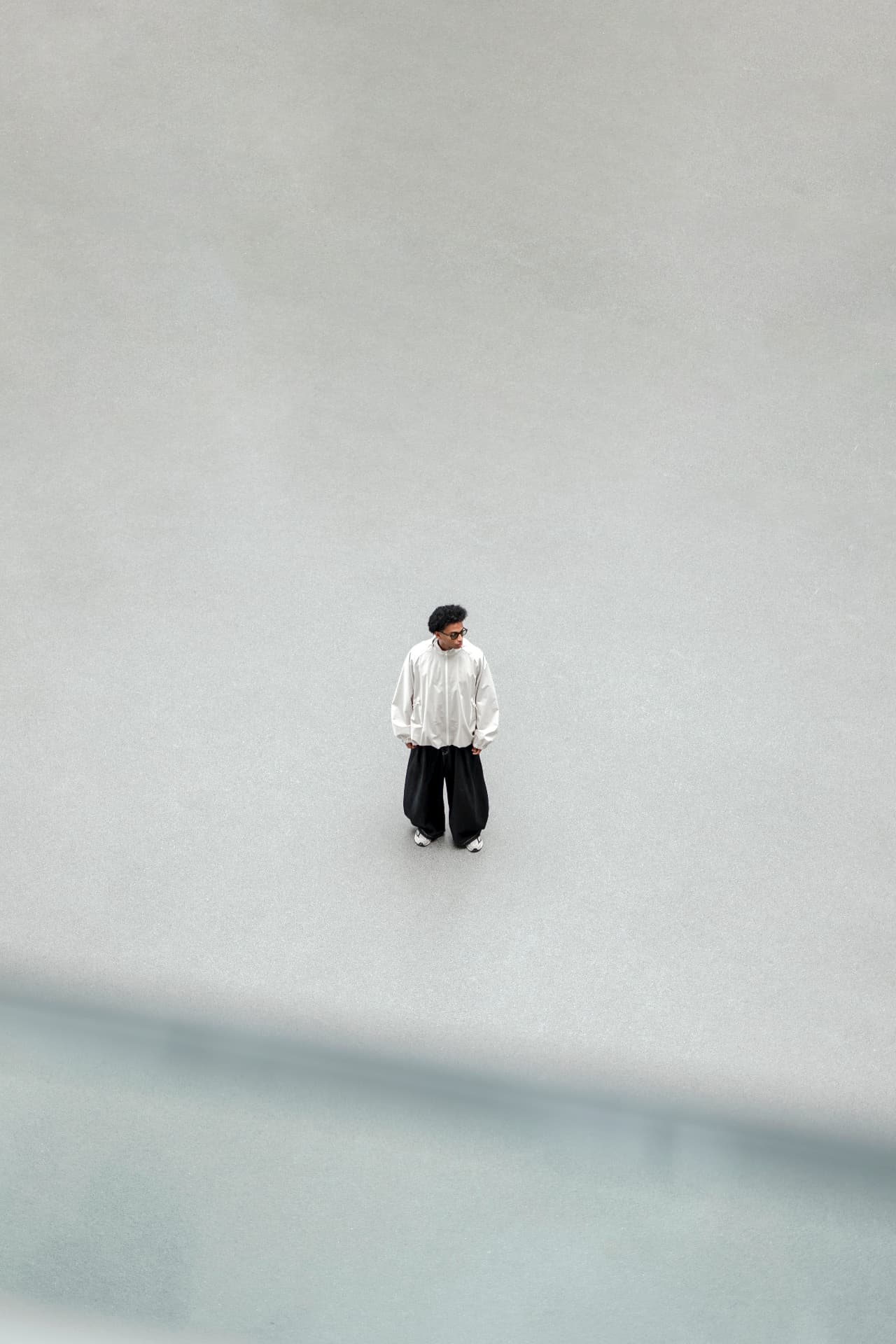 Temry standing on a gray concrete ground — Asia Tour 2026